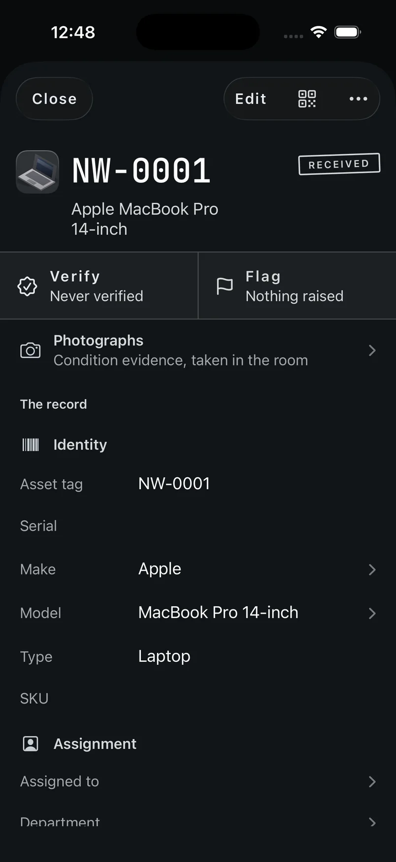 An asset record showing the asset tag and model at the top, a Verify and Flag band, a lifeline of dates, a photo strip, and a scroll of field groups below.